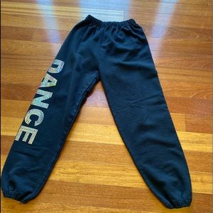 Black sweat pants with holo “Dance” on it . Fit- loose. Color- black. Size-XS.